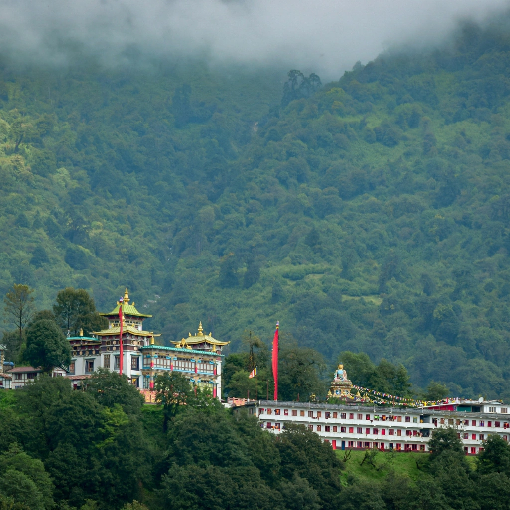 Buddhist monastery in Arunachal Pradesh surrounded by misty green hills showcasing scenic North East India landscape